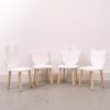 White table and chair set with wooden legs
